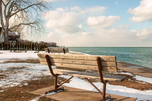 a bench overlooking lake ontario in the community of Niagara on the Lake . High quality photo