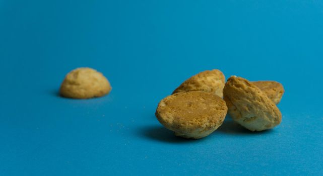 Closeup round butter biscuits. Cookies on a colored background. Dessert, sweetness, lunch.