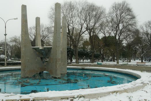 Snow covered park area in Thessaloniki, Greece during Medea weather front bad weather.