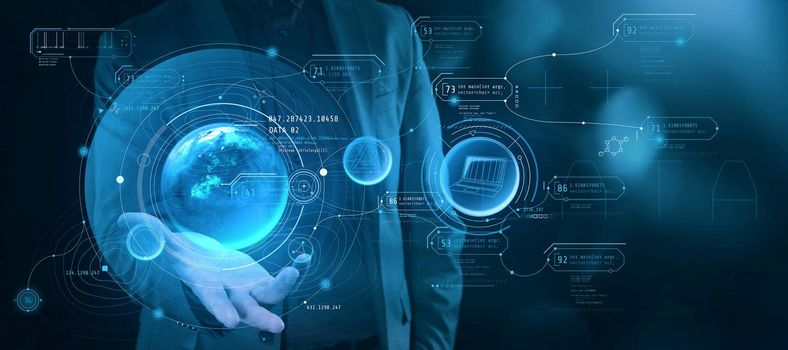 A man holds a projection of the planet with infographic data in his palm.