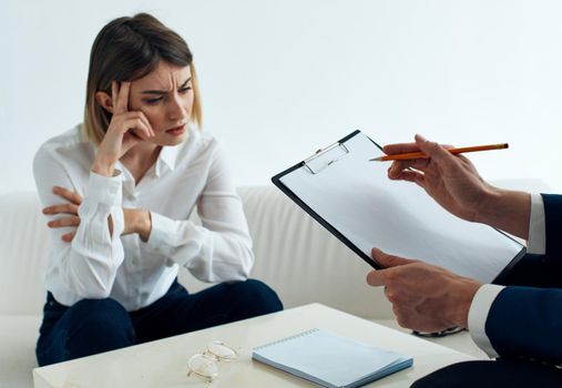 Employees men and women at the table communicating psychologist documents. High quality photo