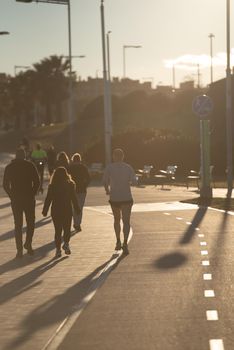 Barcelona, Spain: 2021 February 12:  Man runs along the Barcelona promenade in time of Covid 19 in winter 2021.