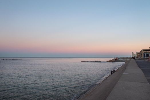 Barcelona, Spain - Febrary, 2021 - Sunset in Nova Icaria Beach in the Barcelona area on the Mediterranean on winter 2021