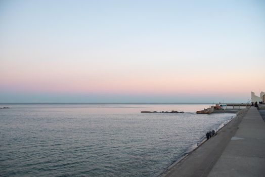 Barcelona, Spain - Febrary, 2021 - Sunset in Nova Icaria Beach in the Barcelona area on the Mediterranean on winter 2021