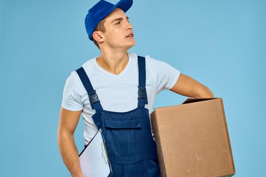 a man in a construction form a box in the hands of a professional service. High quality photo