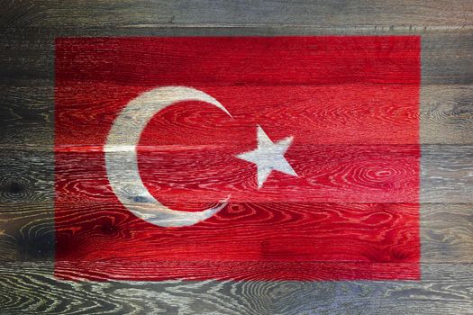 A Turkey flag on rustic old wood surface background
