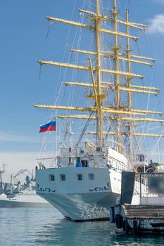 Sevastopol, Crimea. Sailboat "Chersonesos" on the background of the sea and the urban landscape