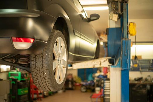 Automobile on overhead crane in the workshop for maintenance