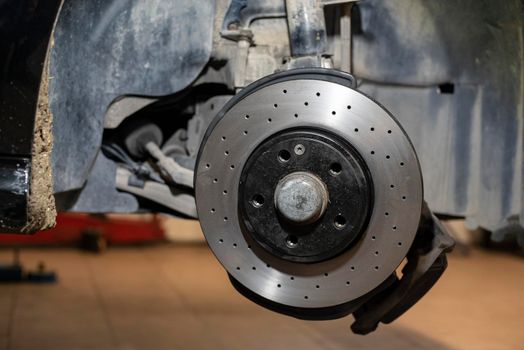 Detail of the Replacement of a car disc brake in the mechanical workshop