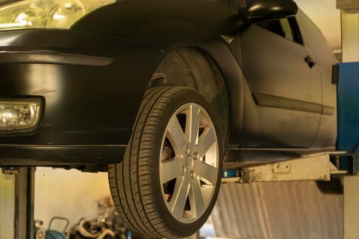 Automobile on overhead crane in the workshop for maintenance