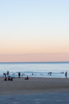 Barcelona, Spain: 2021 February 12: People walk along the Barcelona promenade in time of Covid 19 in winter 2021.