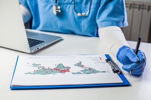 Medical worker analyzing COVID-19 world map,Coronavirus global pandemic outbreak crisis,stats showing worldwide number of infected patients,death toll and mortality rate,possible infection second wave