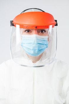 Coronavirus COVID-19 virus disease global pandemic outbreak,medical worker in full personal protective equipment portrait,isolated on white background,serious hospital or laboratory professional