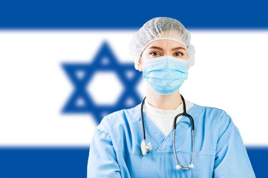 Portrait of a caucasian doctor with flag of Israel in background, COVID-19 virus disease crisis, Coronavirus global worldwide pandemic, social distancing isolation and quarantine concept