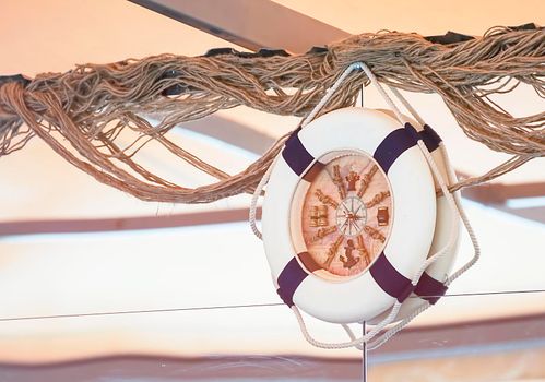 Clock in the form of a lifeline on the wall of the building.