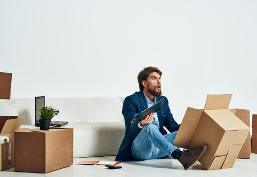 man unpacking boxes stuff office professional job official. High quality photo