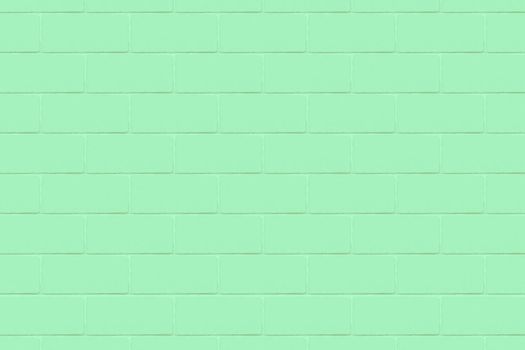 An emerald-colored wall with a detailed close-up texture.Texture or background