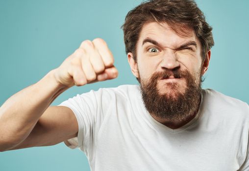 aggression stress man with a beard emotions indignant look fist. High quality photo