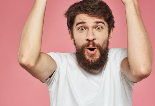 Portrait of happy man with bushy beard emotions model pink background. High quality photo