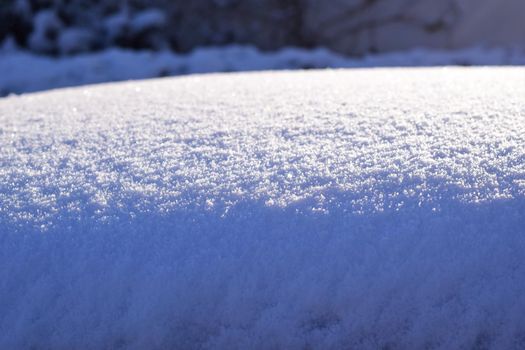 Iced snow in the sunlight as a close-up