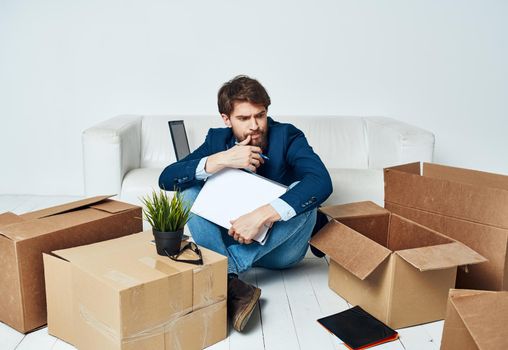 Business man documents boxes with things unpacking office manager. High quality photo