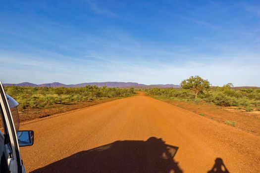 Red Australian Rural Road with Cloudy Blue Skies, WA