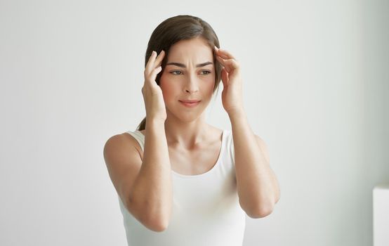 woman with a cold holding her head flu health problems. High quality photo