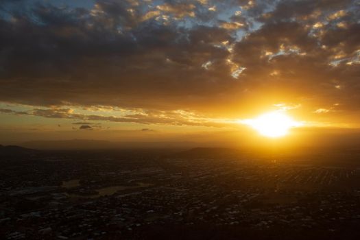 Sunset view of Townsville, Queensland, Australia looking from Castle Hill towards the coast and calm