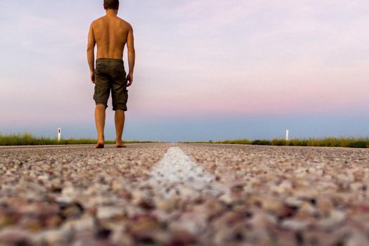 straight road through the outback of Australia, after a beautiful sunset