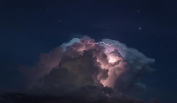 Storm cloud with some lightning in the australian outback, cloncurry, australia, northern territory.