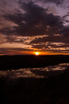 shot through tress of a beautiful sunset in the australian outback with 1 lakes, Nitmiluk National Park
