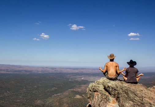 jung women and men sitting on St Mary's Peak from the Flinders Ranges National Park, Australia