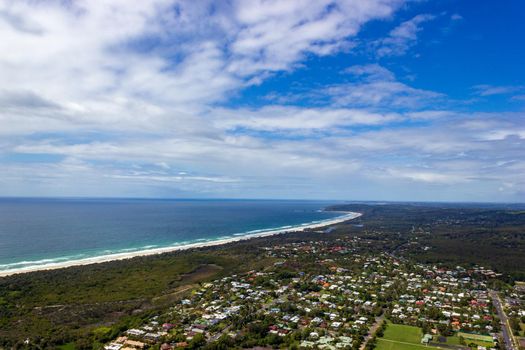 Wategoes Beach aerial view at Byron Bay with lighthouse