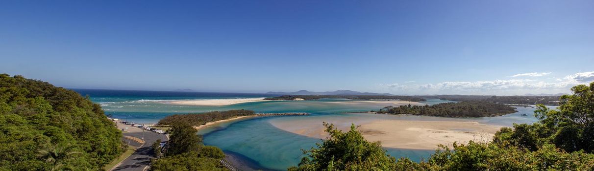 Flat sand dunes on the delta of the Nambucca River, which enters the Pacific Ocean through wide sandy beaches of the Australian coast around Nambucca Heads Town.