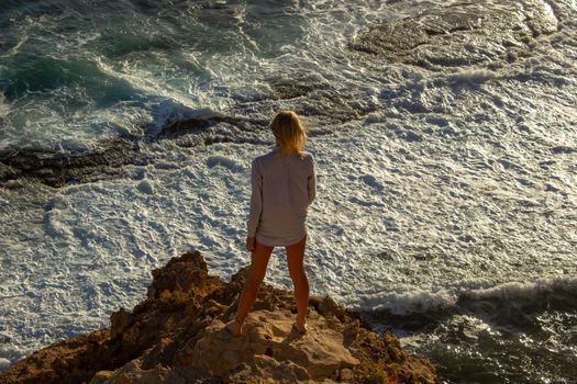 jung women standing on cliffs near port lincon at sunset, South Australia, australia