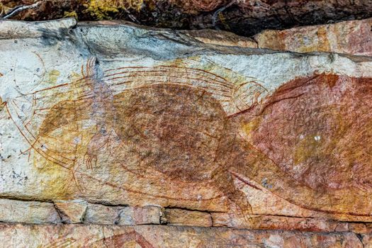 Ancient Aboriginal Art: hand prints, animal herds, spiral in a cave, Kakadu National park, australia
