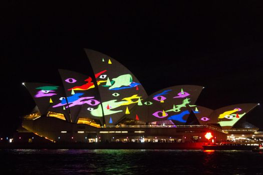 SYDNEY, AUSTRALIA - JUNE 9, 2013: Sydney Opera House during Vivid Sydney festival. Vivid Sydney is an outdoor annual cultural event featuring immersive light installations and projections.