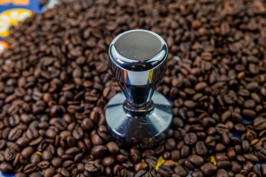 coffee beans with steel coffee press for bars