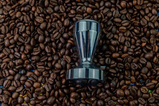 coffee beans with steel coffee press for bars
