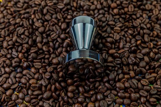 coffee beans with steel coffee press for bars