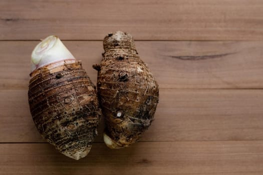 Taro on table wood background.