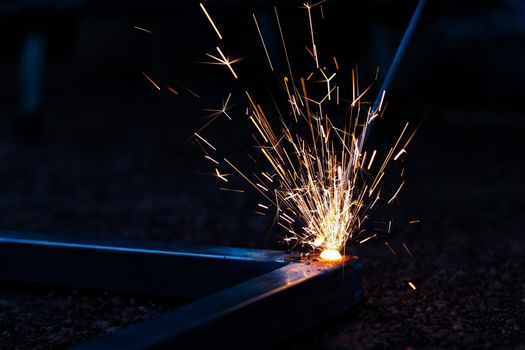 Technician focus on welding process on spark light with equipment.