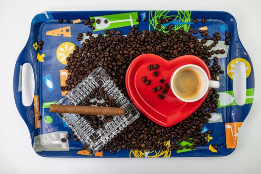 tray with coffee grains, heart shaped cup and saucer and ashtray with cigar