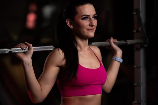 pretty young fitness woman at the gym on a fitness machine.