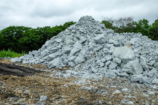 A pile of building crushed stone crushed stone at a construction site.