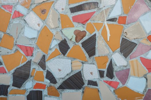 Colorful ceramic mosaic floor or wall. mosaic top view. Bathroom or kitchen floor wall design idea. Reused broken tile. Interior design. Colored eastern pottery.