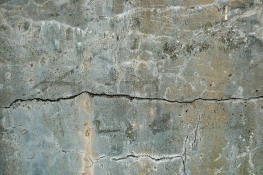 Grunge concrete cement wall with crack in industrial building, great texture background.