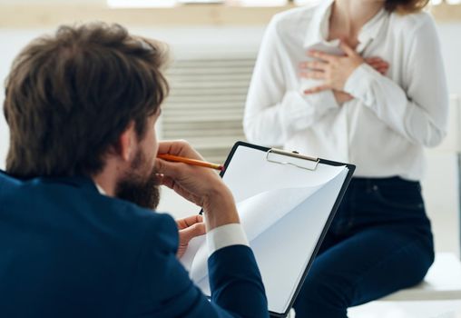 Male psychologist next to the patient communication psychotherapist consultation problem. High quality photo