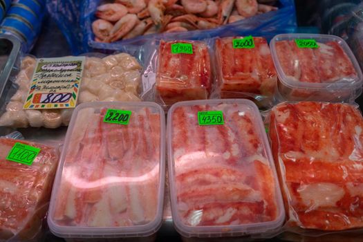 Petropavlovsk-Kamchatsky, Russia-October 6, 2019: Crabs and shrimps in the seafood market showcase.