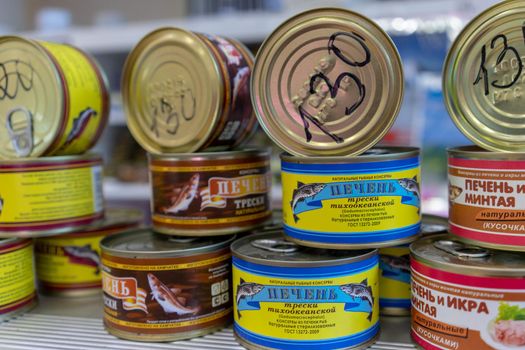 Petropavlovsk-Kamchatsky, Russia-October 6, 2019: canned Fish in the seafood market showcase.